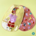 bavoir-en-toile-ciree-jaune-peppa-pig (1).jpg